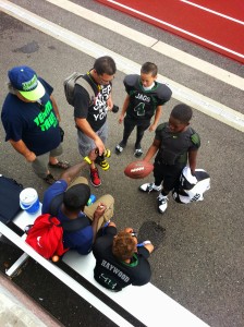 Marcus Trufant takes the time to sign autographs w/ his young fans at his 1st Annual Football Jamboree. 